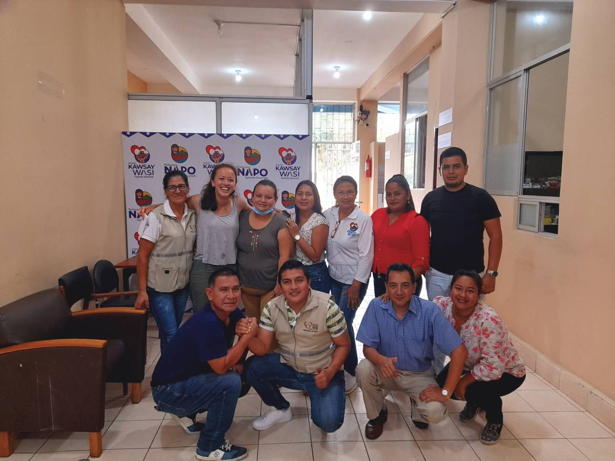 Smiling group pic inside clinic.
