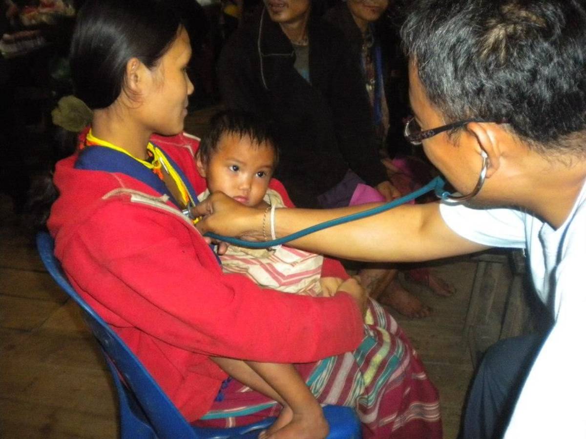 Using stethoscope to check the baby