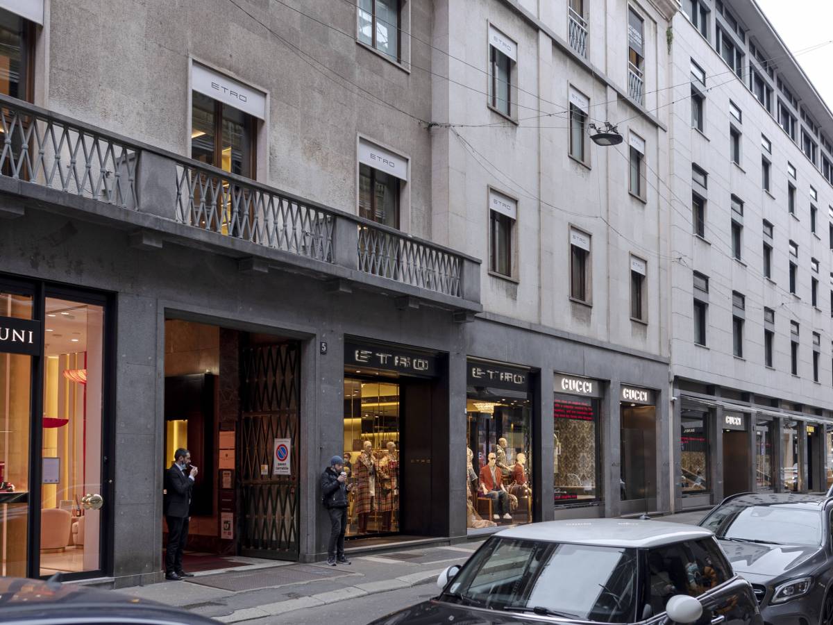 Street with apartments, shop fronts, windows and balconies