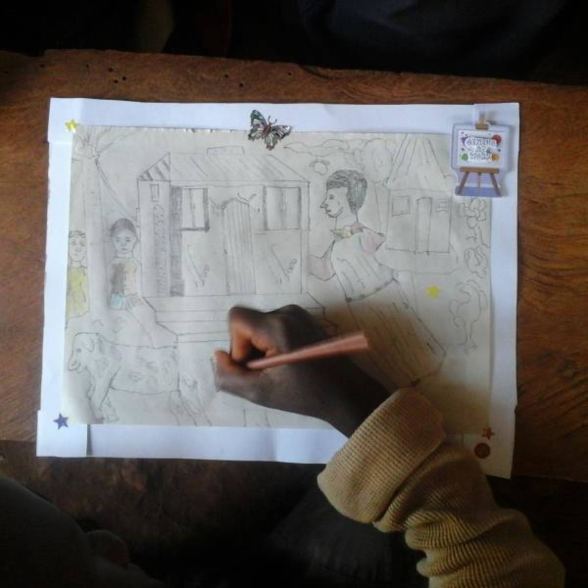 doing crafts with the kids at a school in Uganda