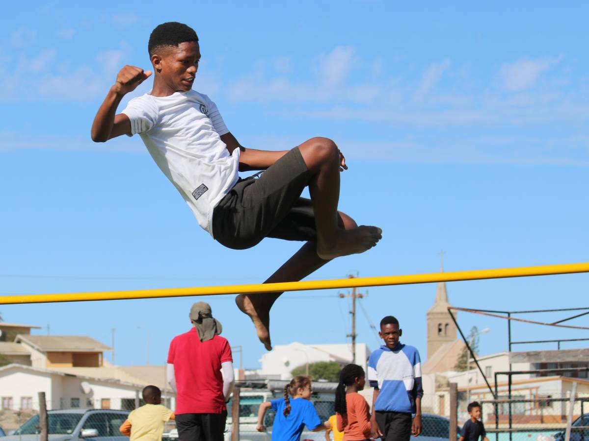 Student competing in high jump at LBS sports day, Lüderitz