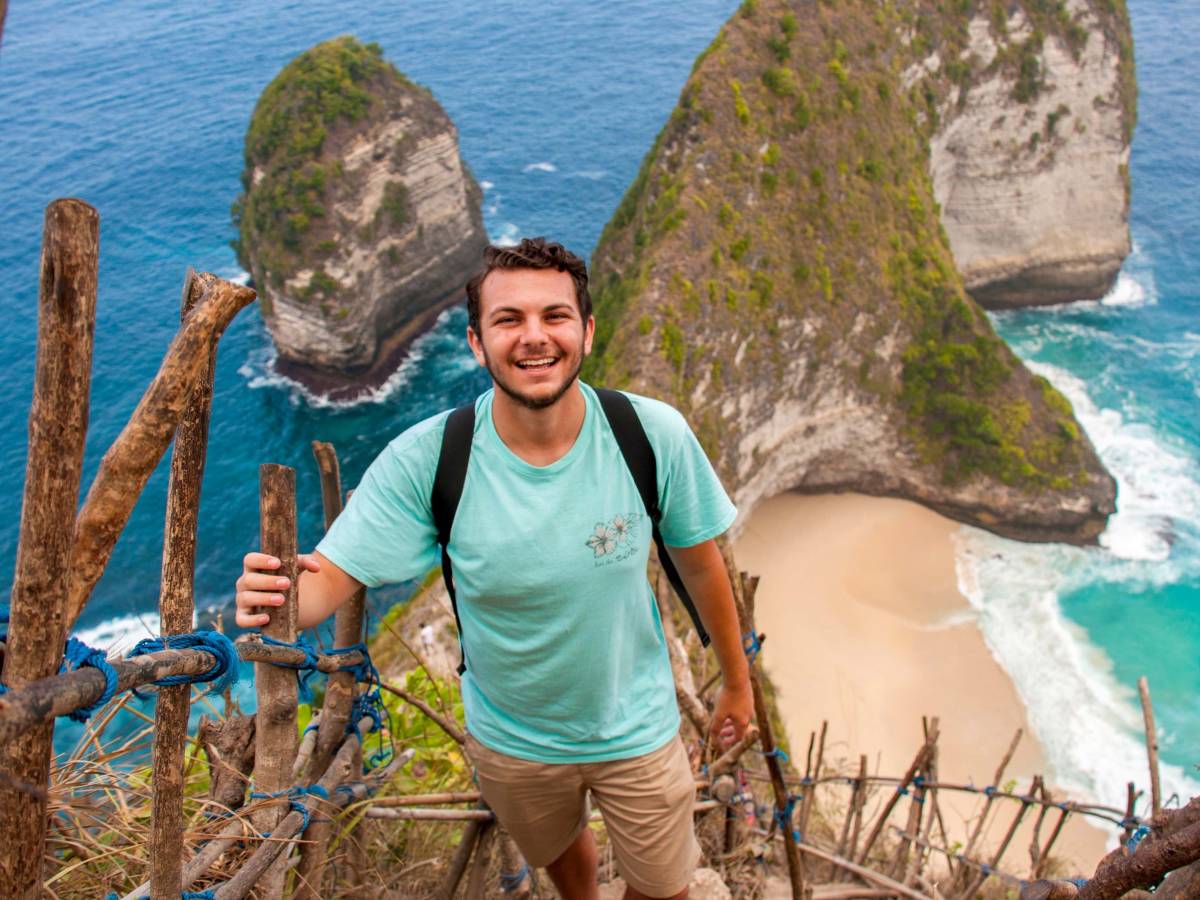 Student hiking up mountain in Indonesia