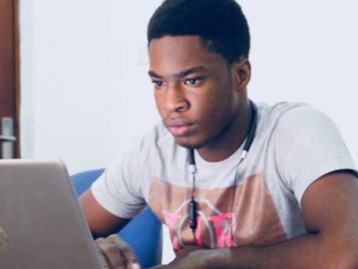 Student on a computer watching the screen intently