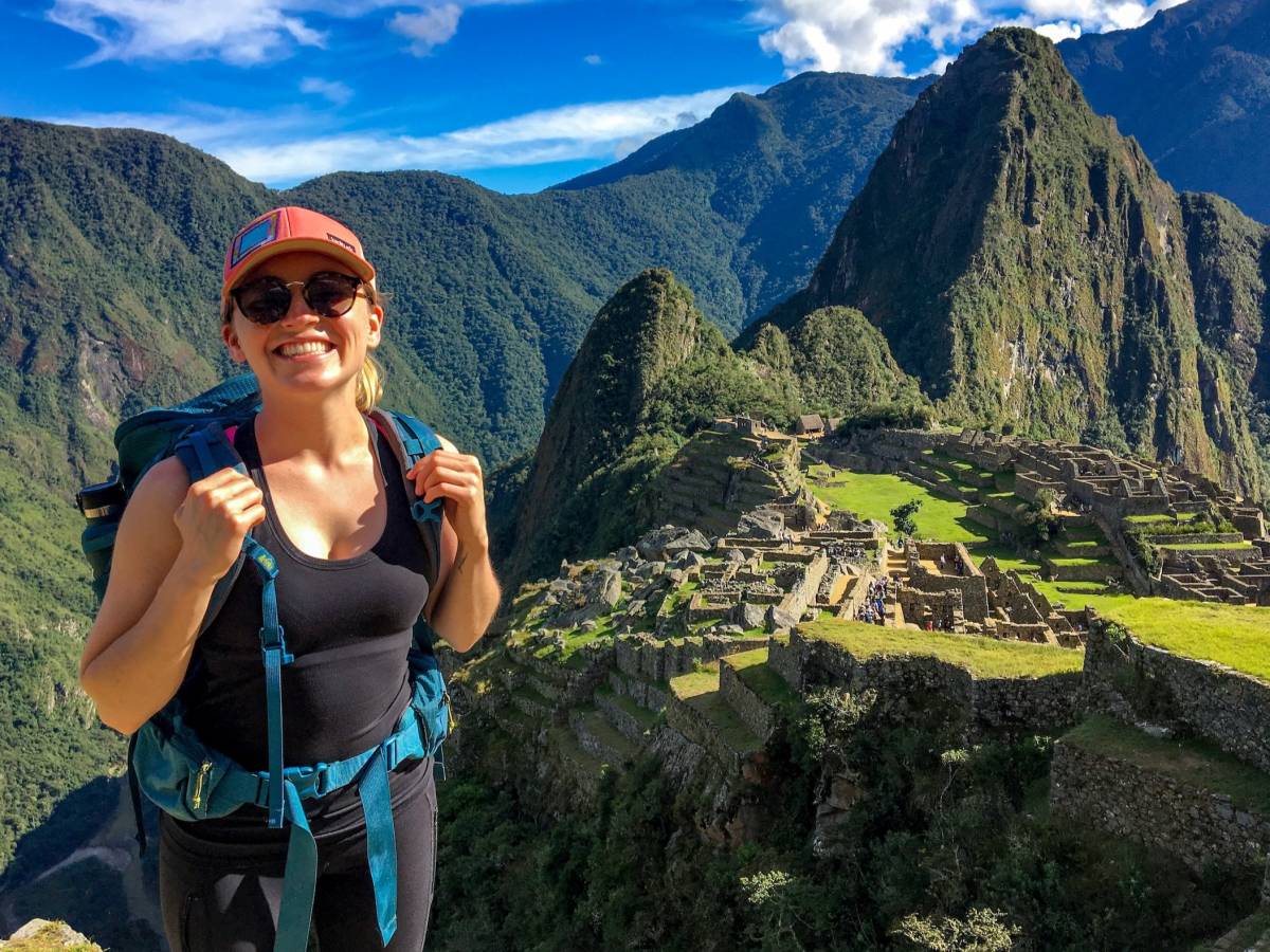 Student poses in front of Machu Pichu.