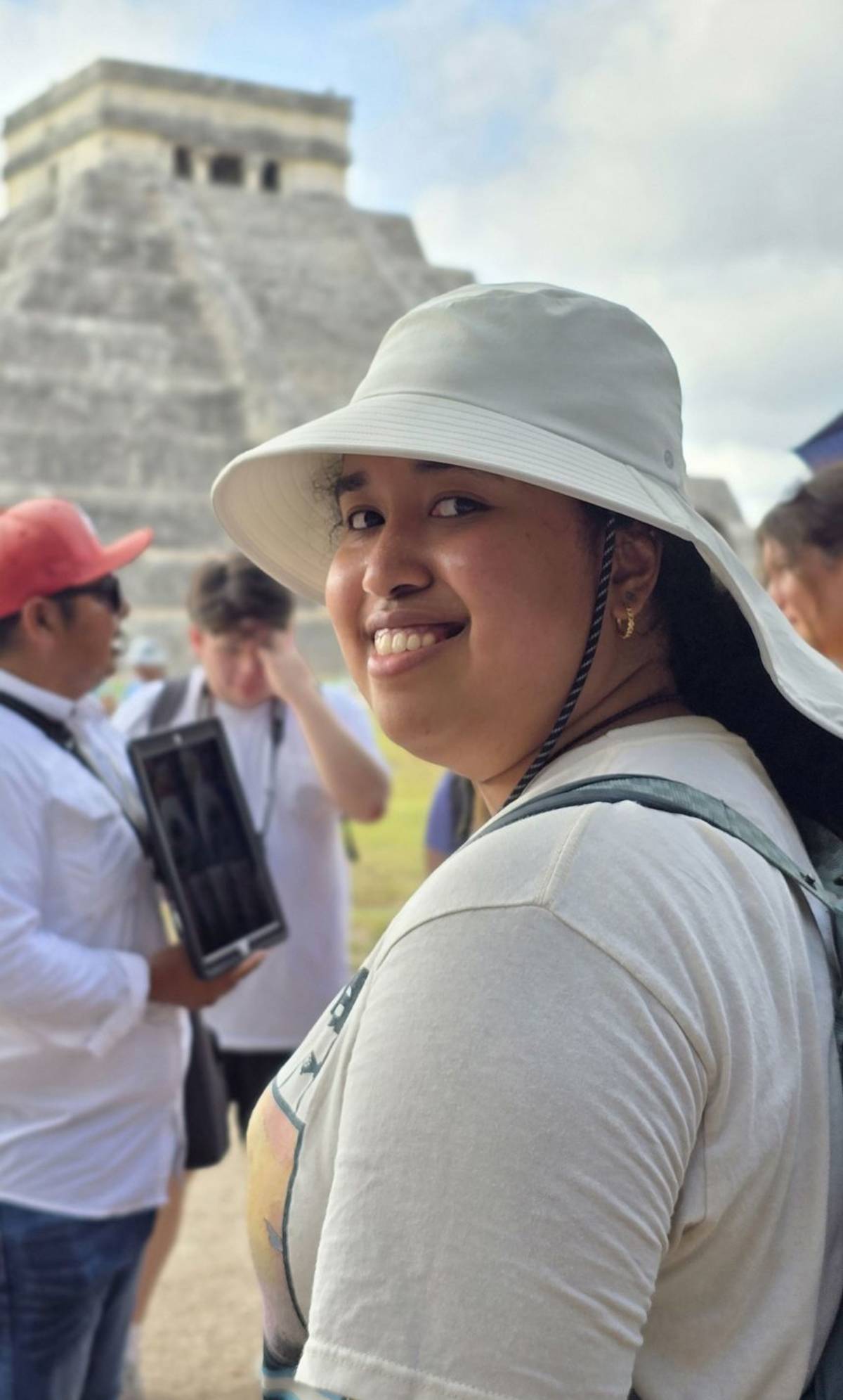 Student posing in front of temple in Chichen itza