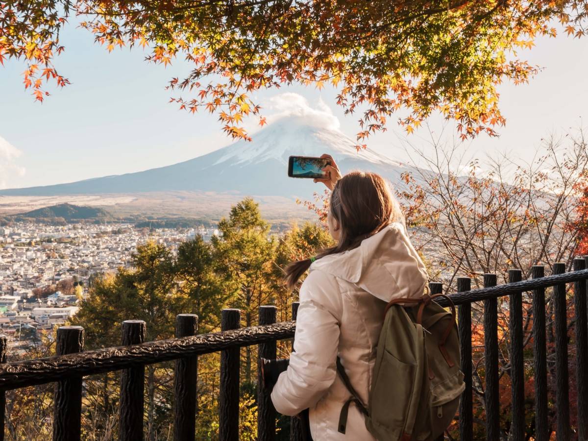 Student taking a photo of Mount Fuji in Japan