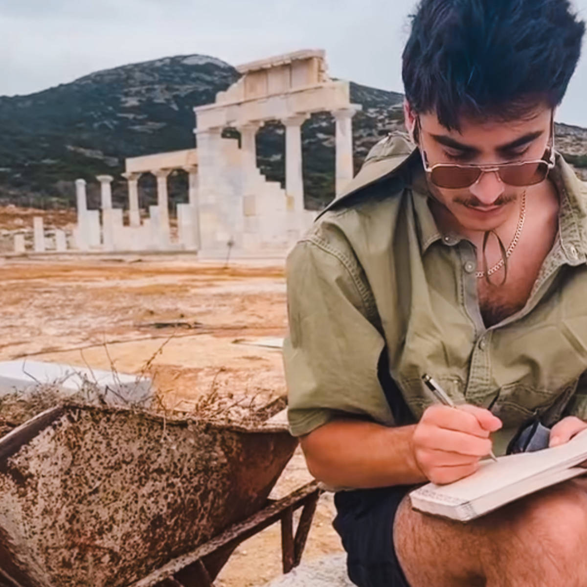 student taking notes at archaeology site