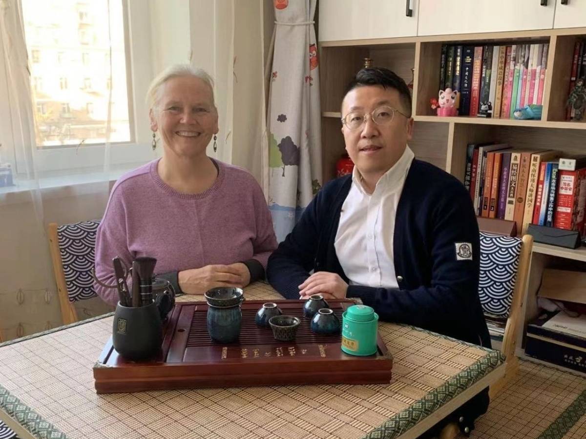 Student taking part in a tea ceremony with her teacher in Dalian.