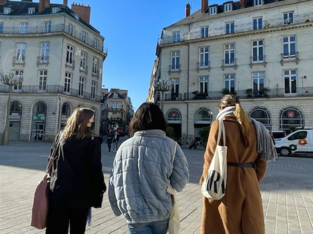 student walking through plaza in Nantes