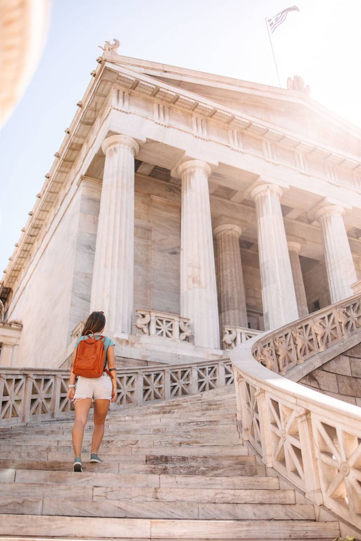 Student walking up steps in Athens
