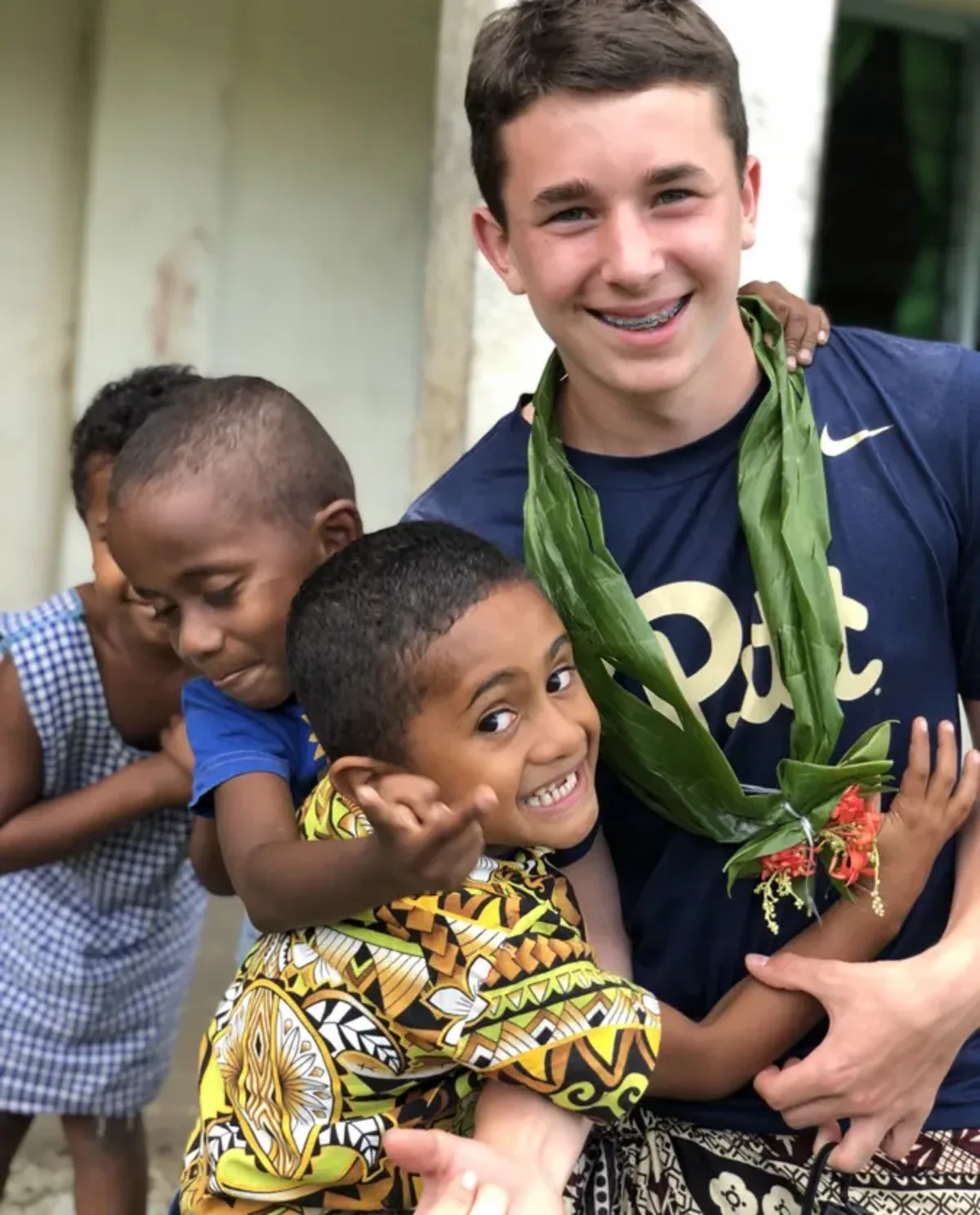 Student with local kids