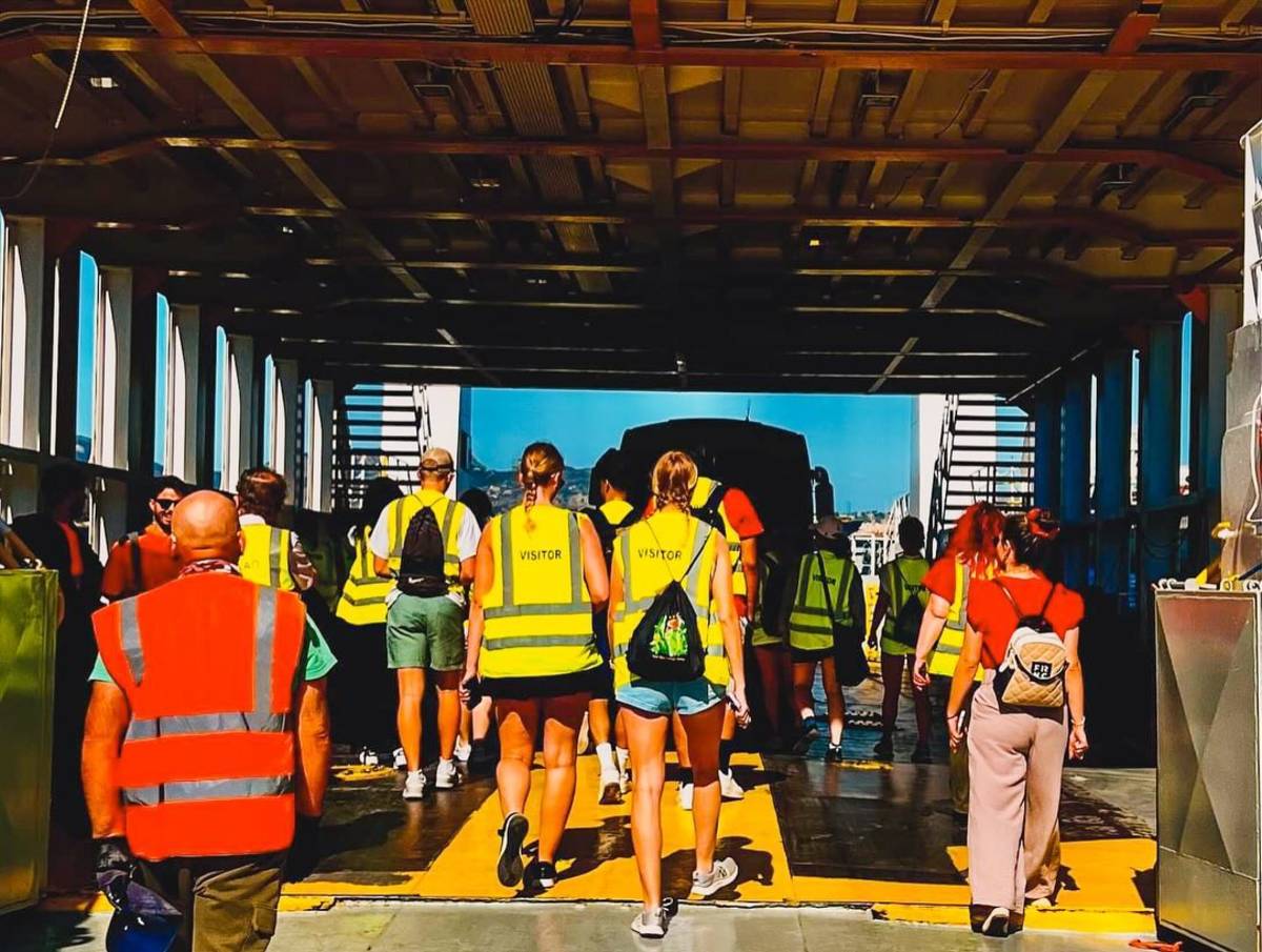 students boarding a boat for biology course
