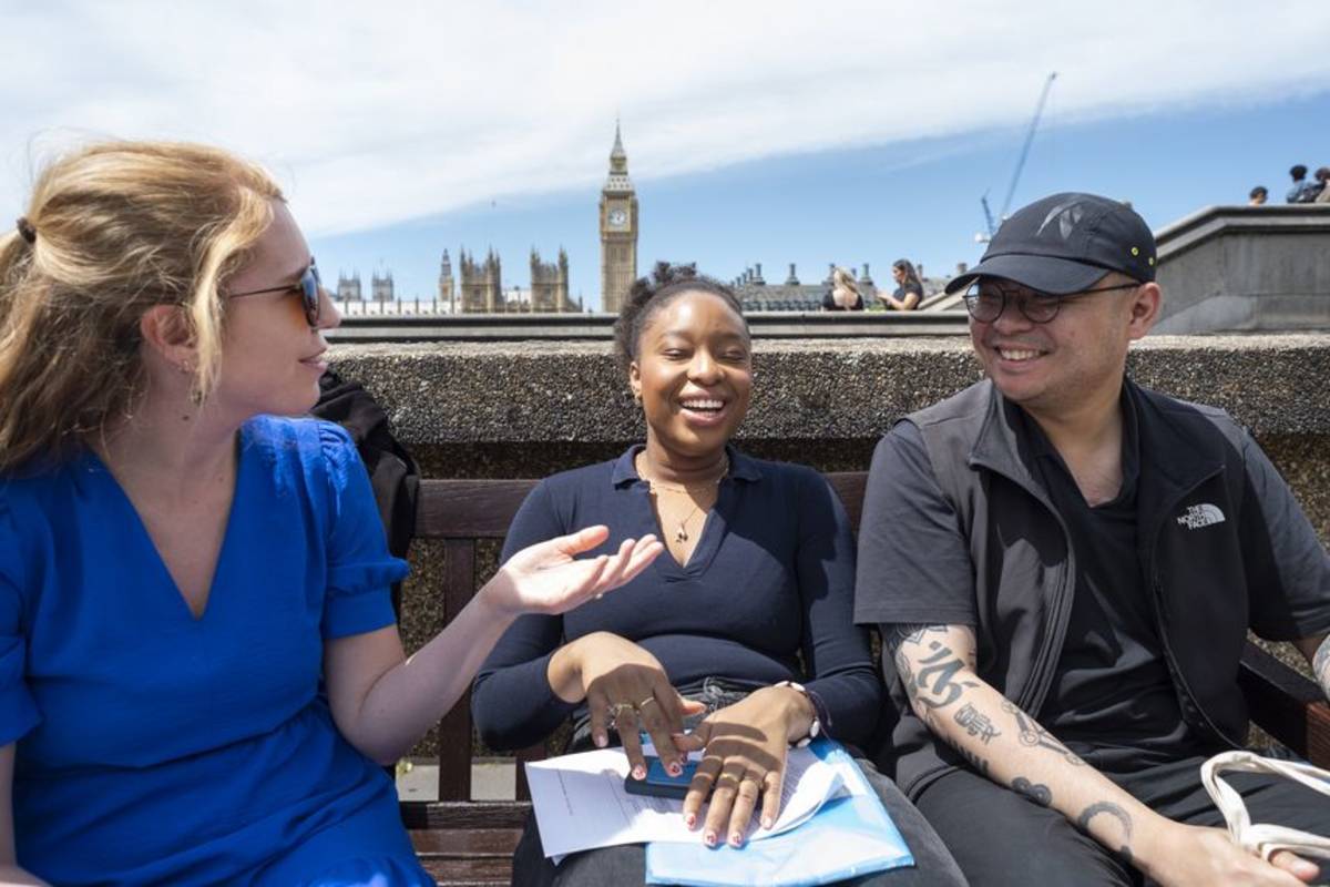 Students chatting with Big Ben in the distance
