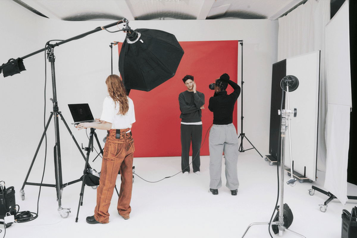 Students conducting a photo shoot in a studio