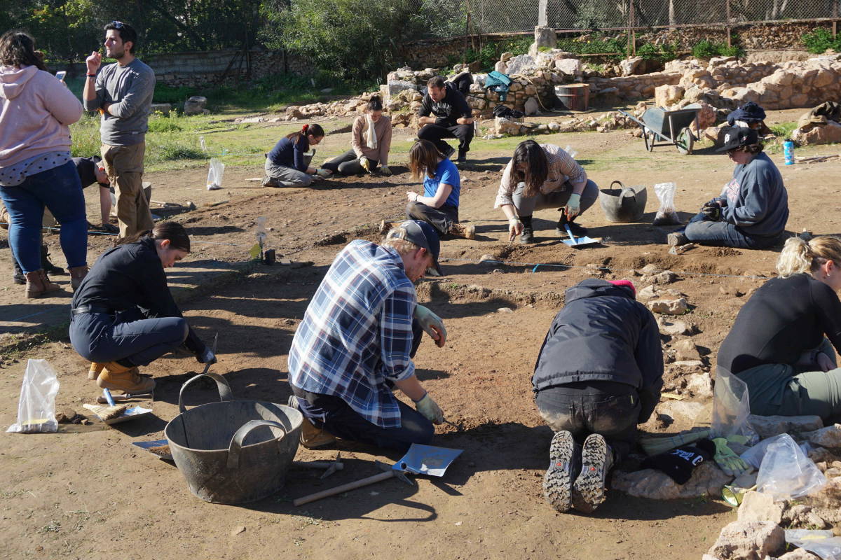 Students digging at excavation site