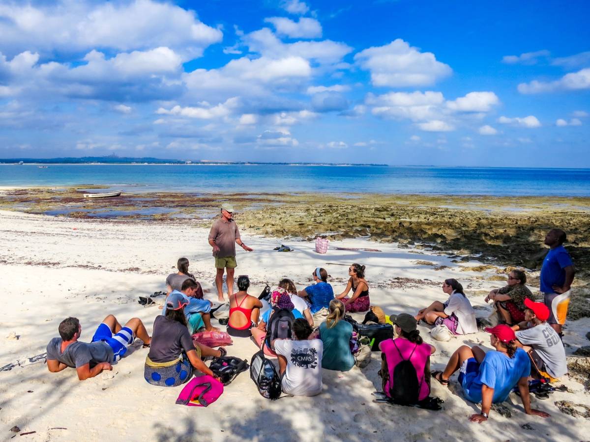 Students have class on beach in Zanzibar