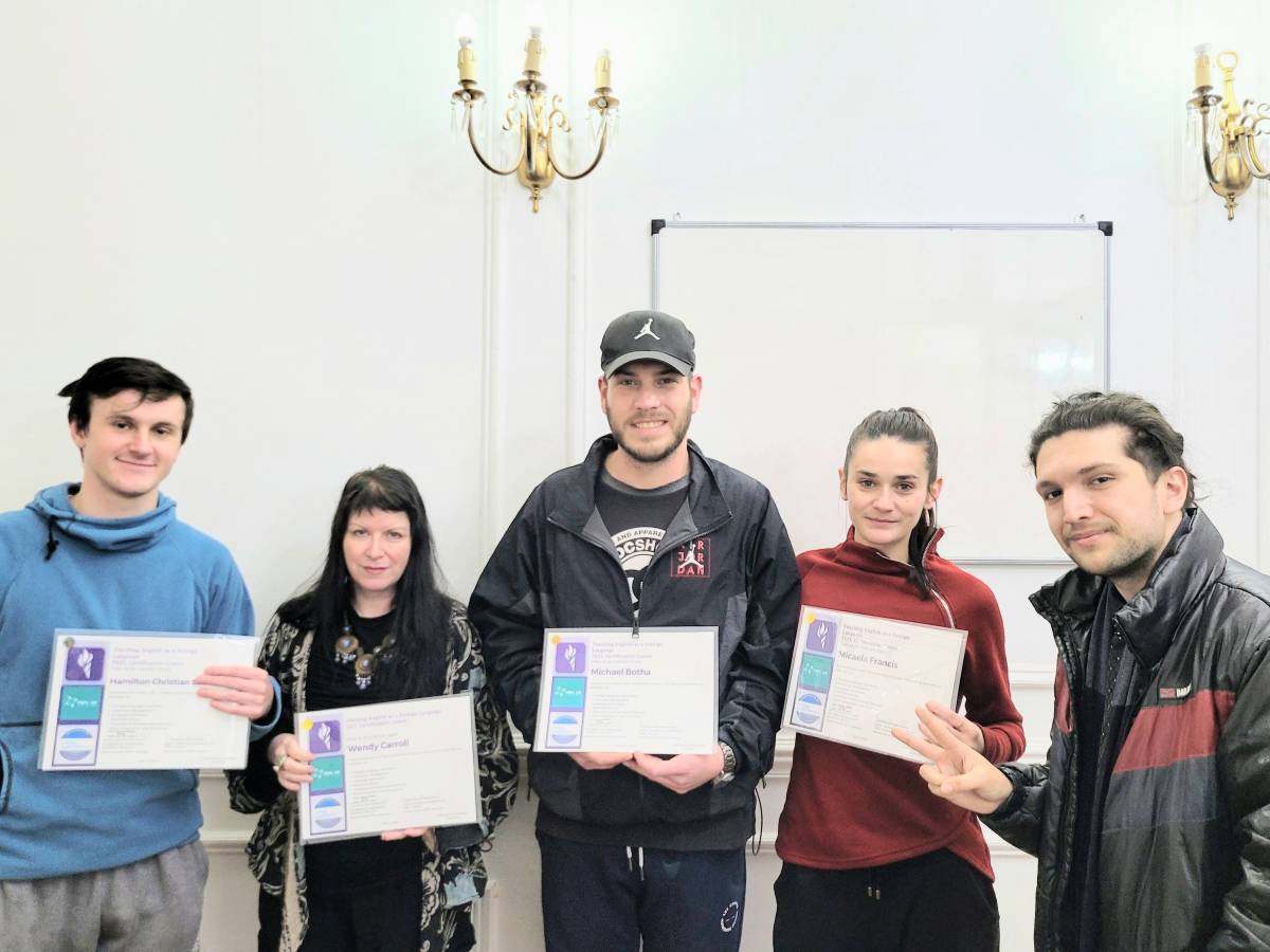 students holding their certificate