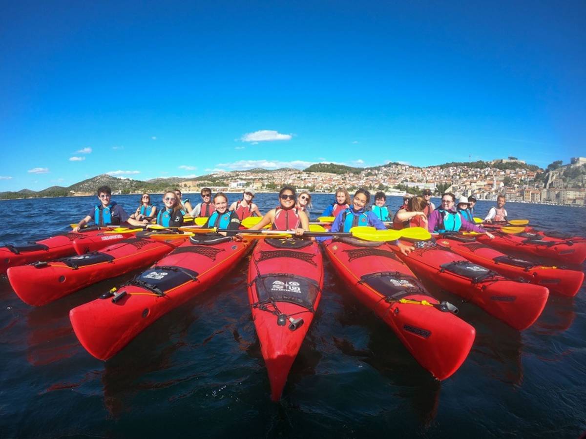 students in kayaks