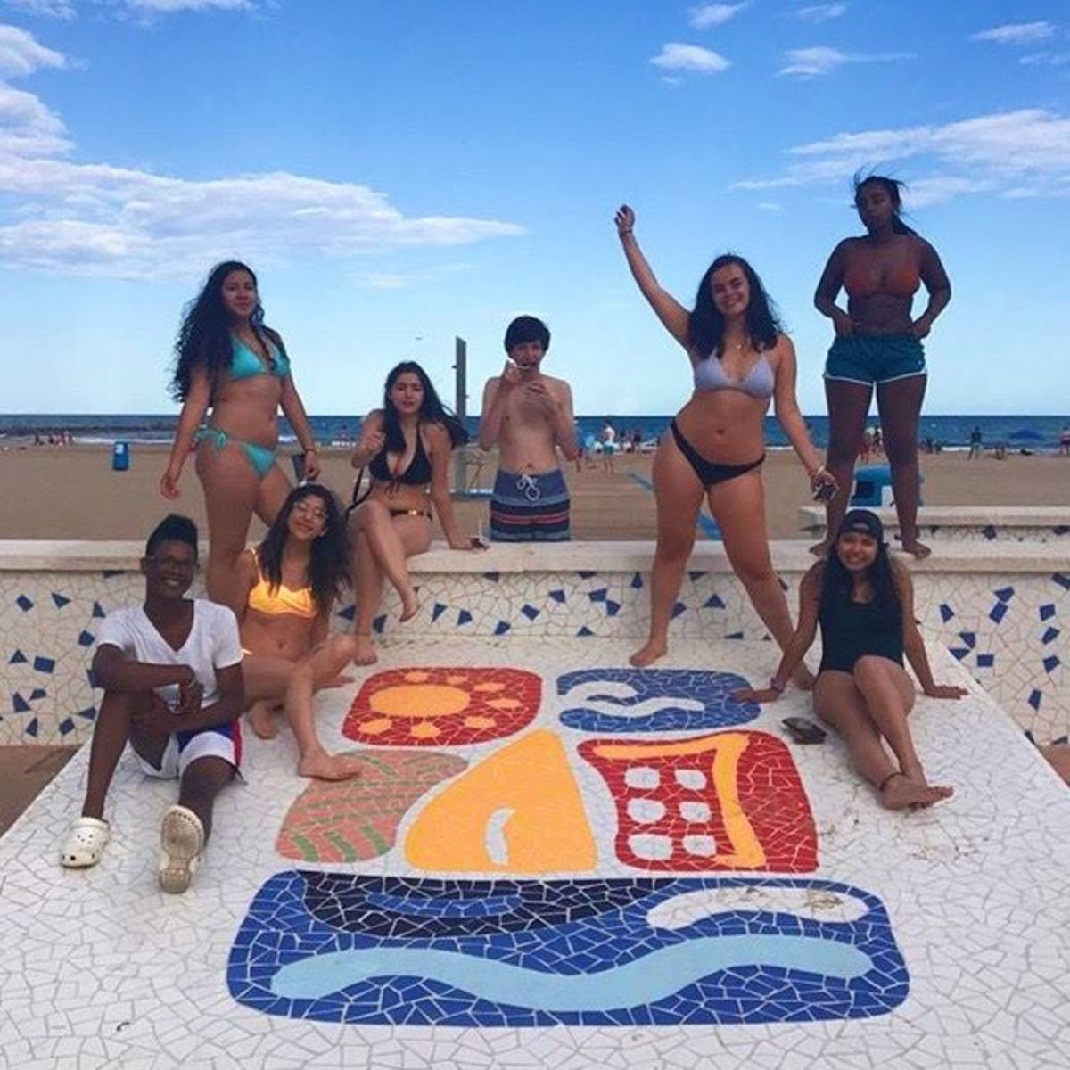 Students in swimsuits on the beach in Palma de Mallorca