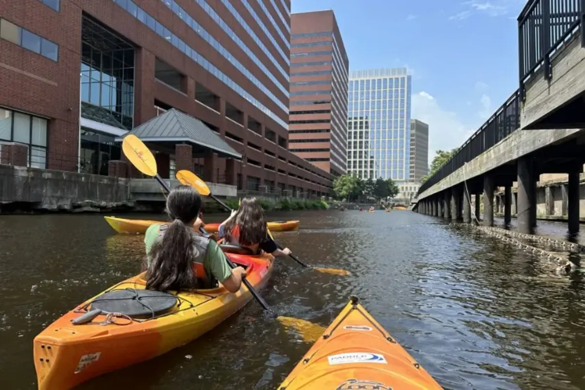 Students kayak in city