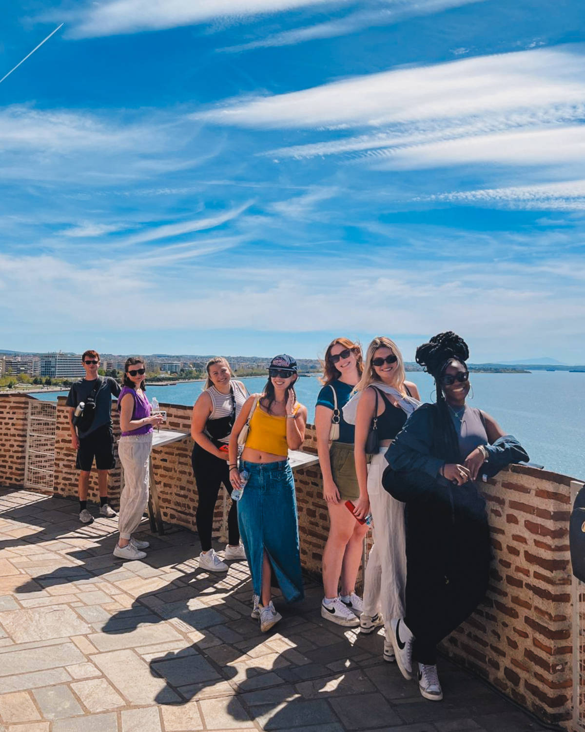 Students lined up overlooking the sea