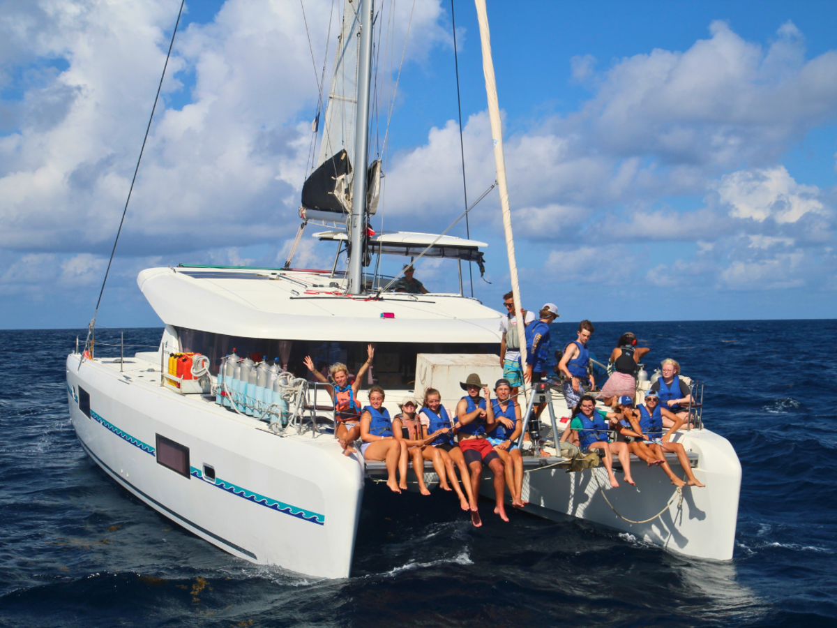 students on catamaran deck