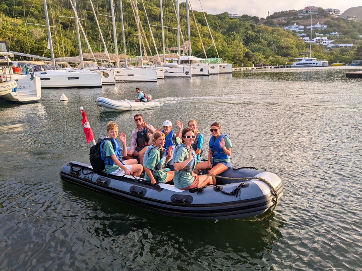 students on dinghy at start of dive and sail trip in the Caribbean