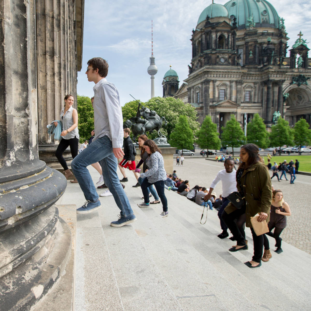 Students on the steps of a building.