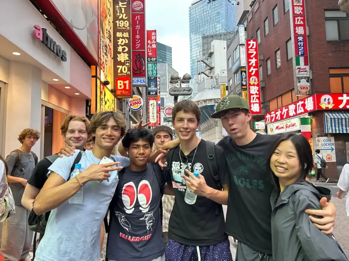Students pose for group picture on street in Japan