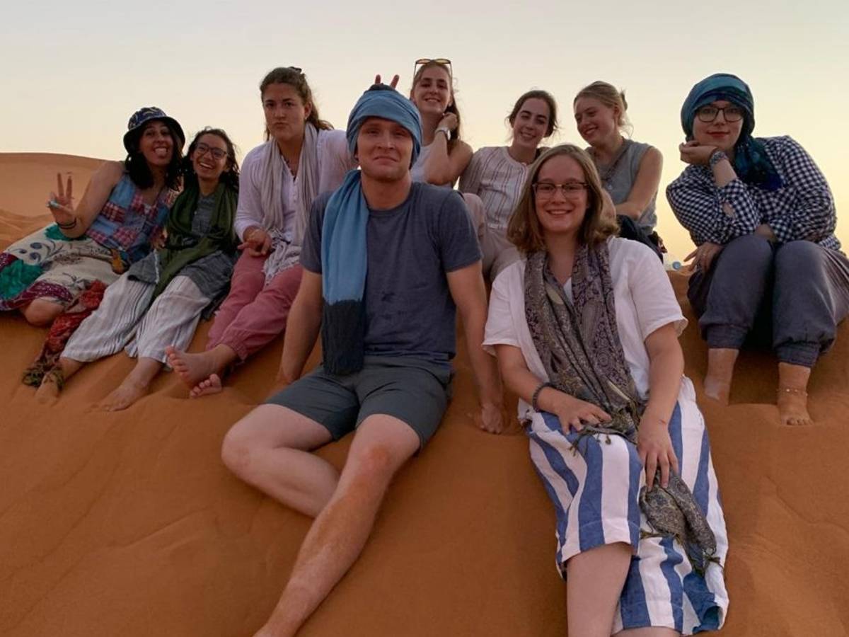 Students posing on the dunes