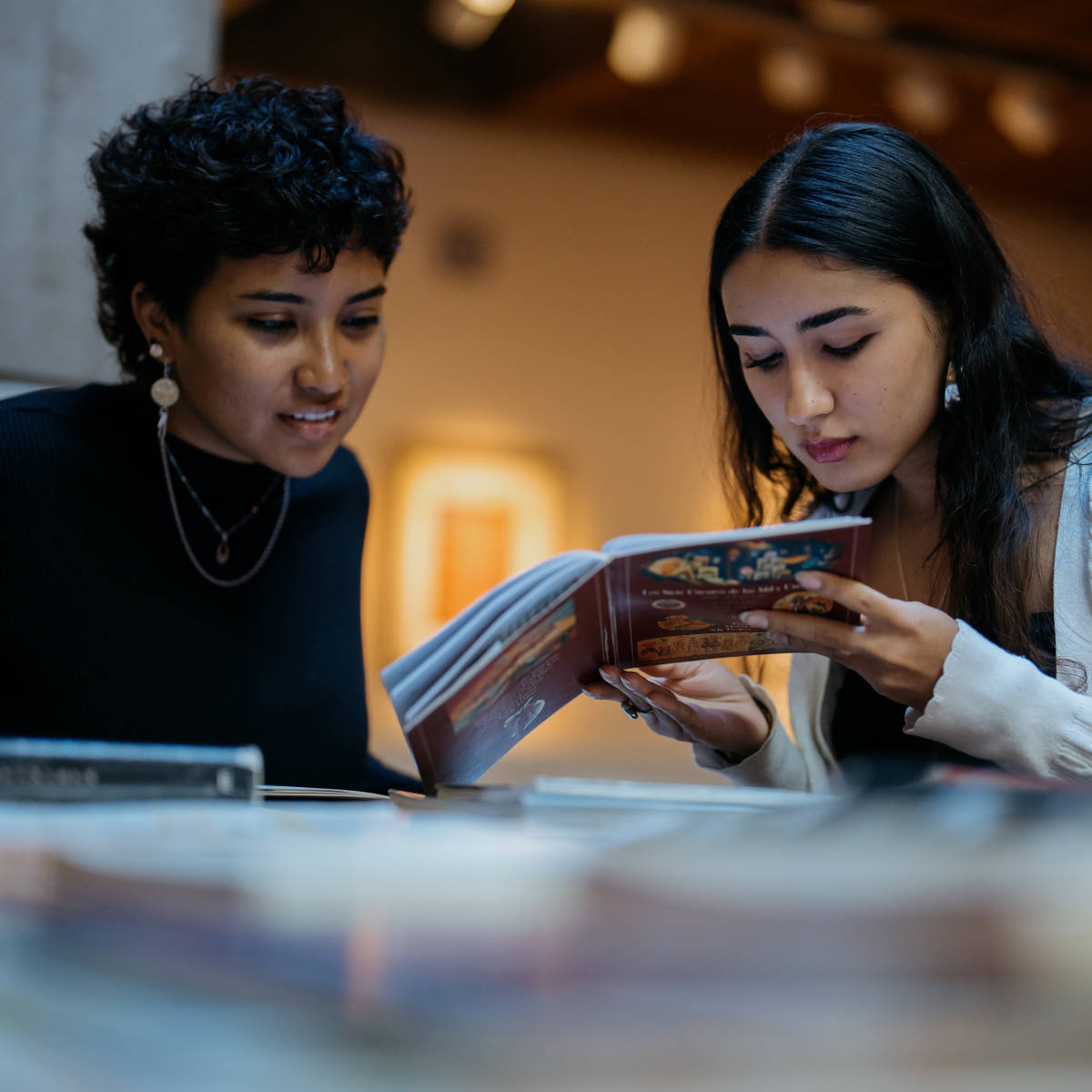 Students read a book. 