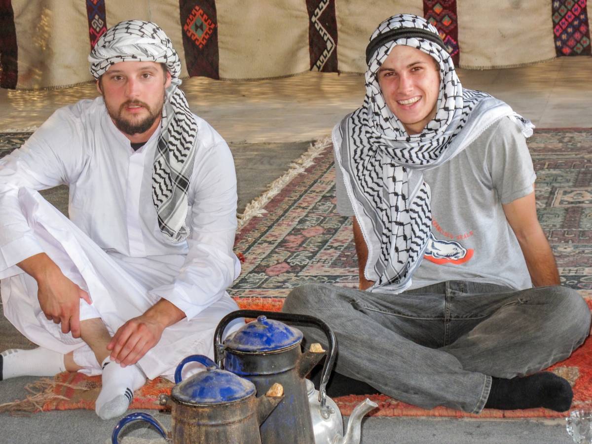 Students sitting in a Bedouin tent