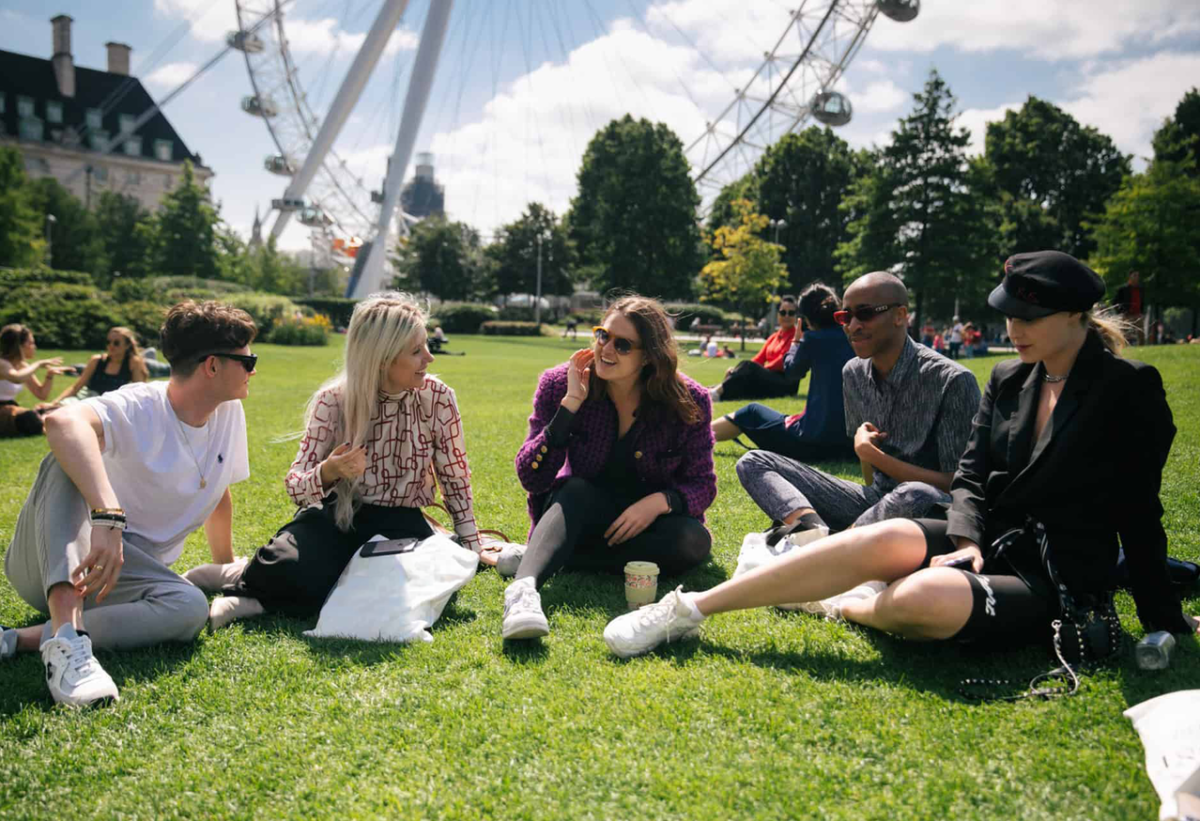 Students sitting on lawn in London