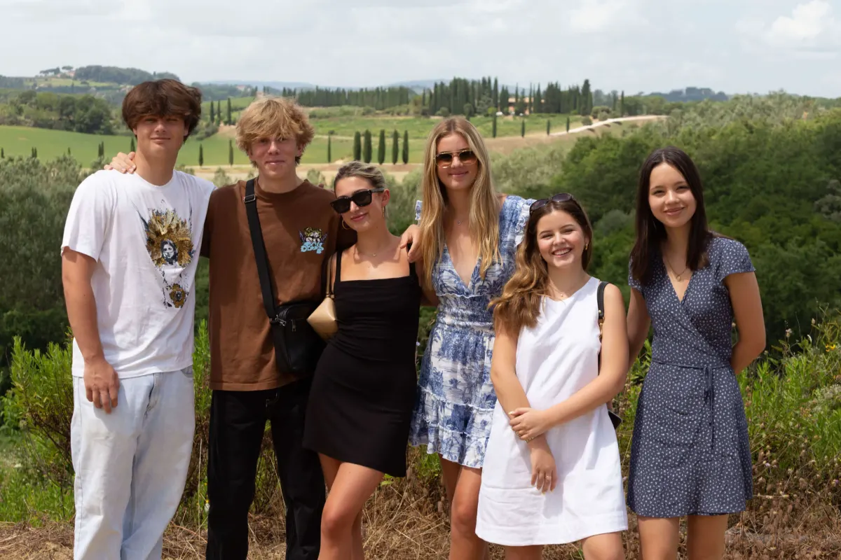 Students stand in vineyard