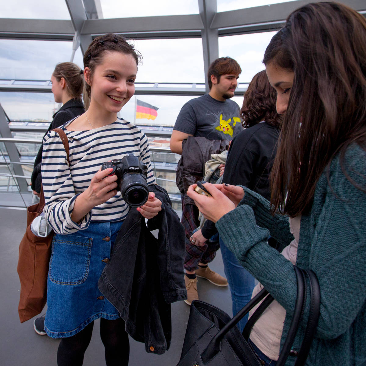 Students taking pictures and chatting.