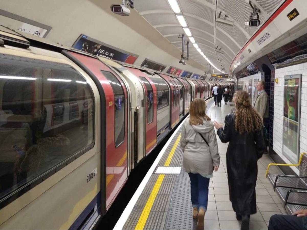 Students walk along the platform at Shepherd’s Bush Underground station in London.