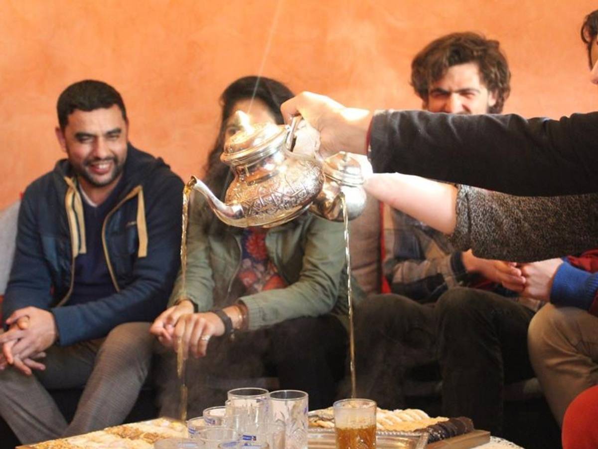 Tea is poured for students