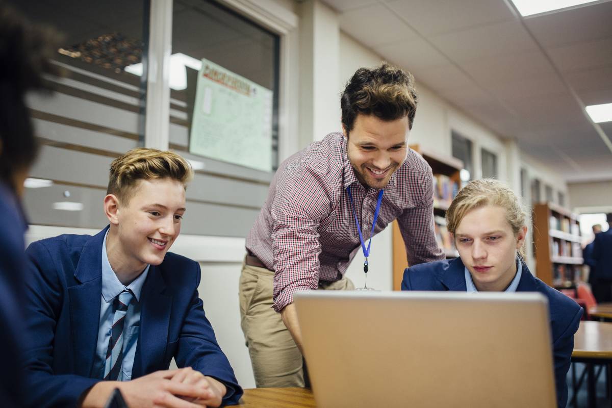  Teacher working with two students