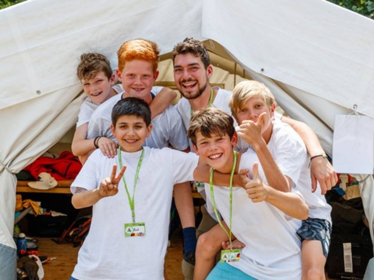 TEFL teacher leading an English summer camp in Germany with students during an outdoor learning activity.