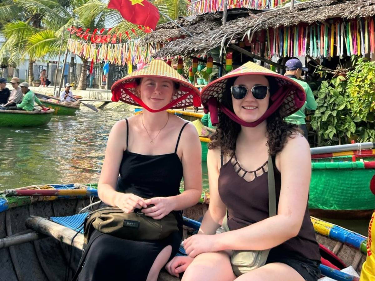 TEFL teachers exploring Hoi An's famous basket boats during a weekend trip in Vietnam.