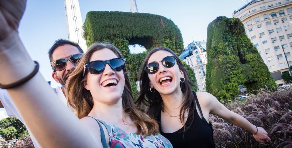 three people doing selfie