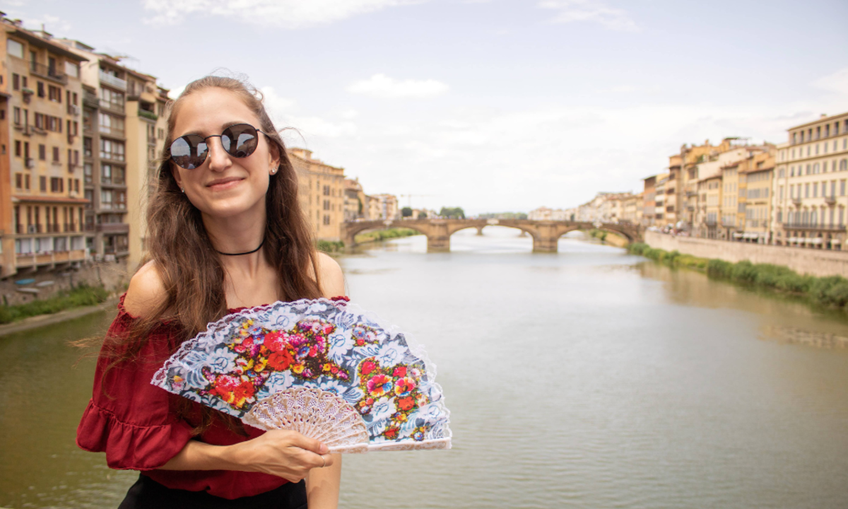 Travel Moment on a Florence Bridge Overlooking the Arno River