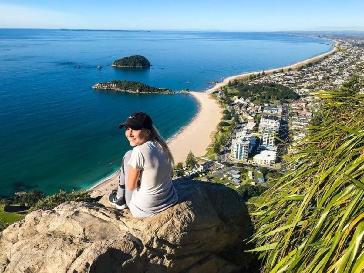 Traveller overlooking Mount Maunganui beach in New Zealand