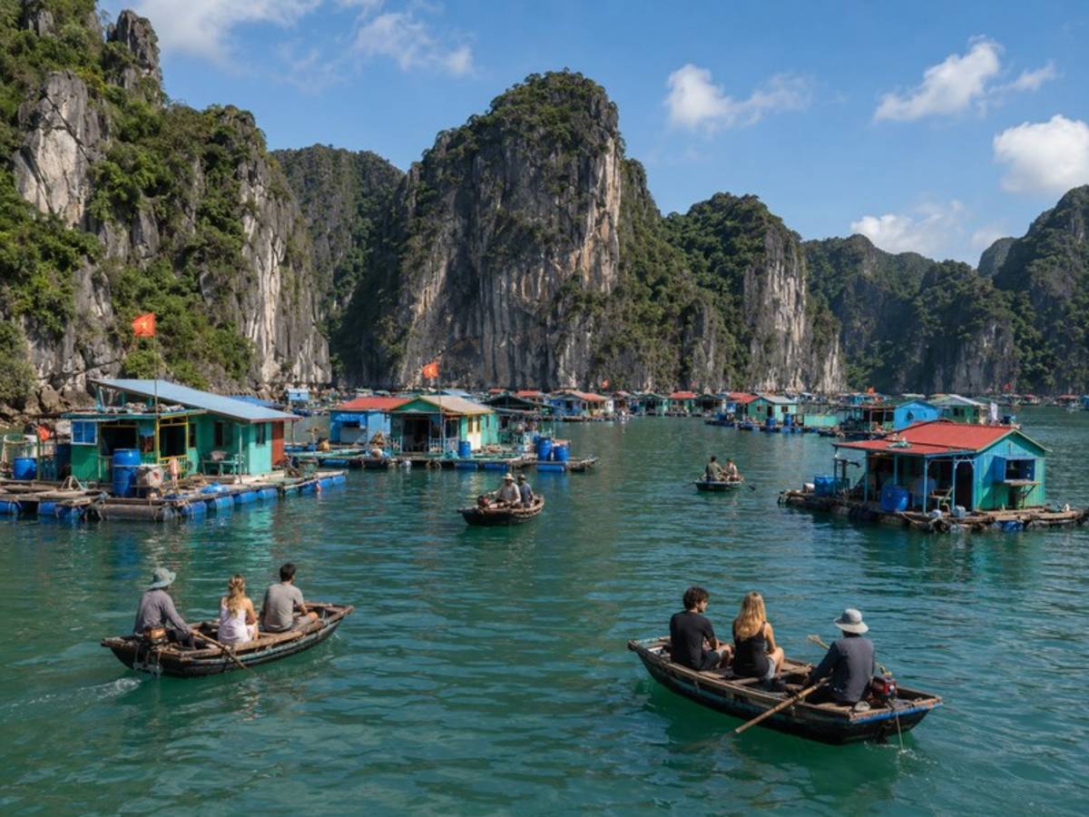 Travellers boating through a Vietnamese floating village