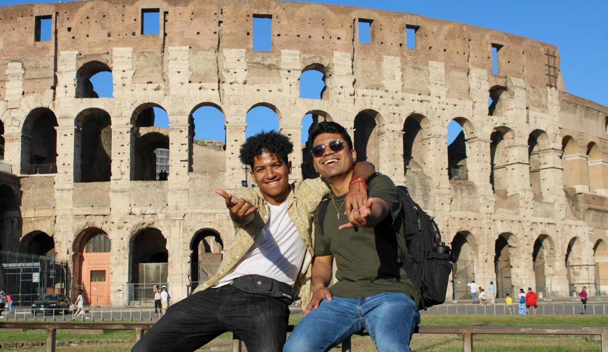 Two boys in front of the Coloseum