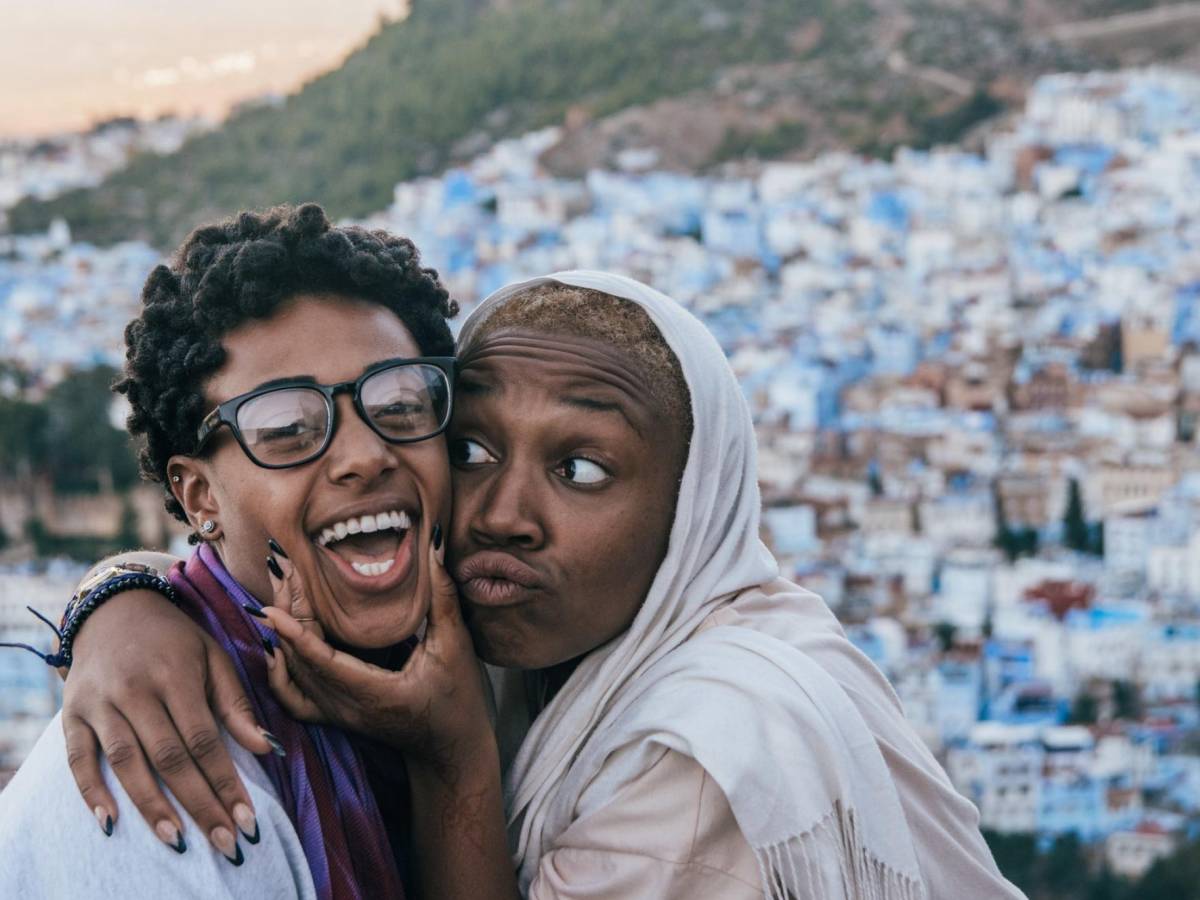 Two female students smile overlooking Chefchauen in Morocco