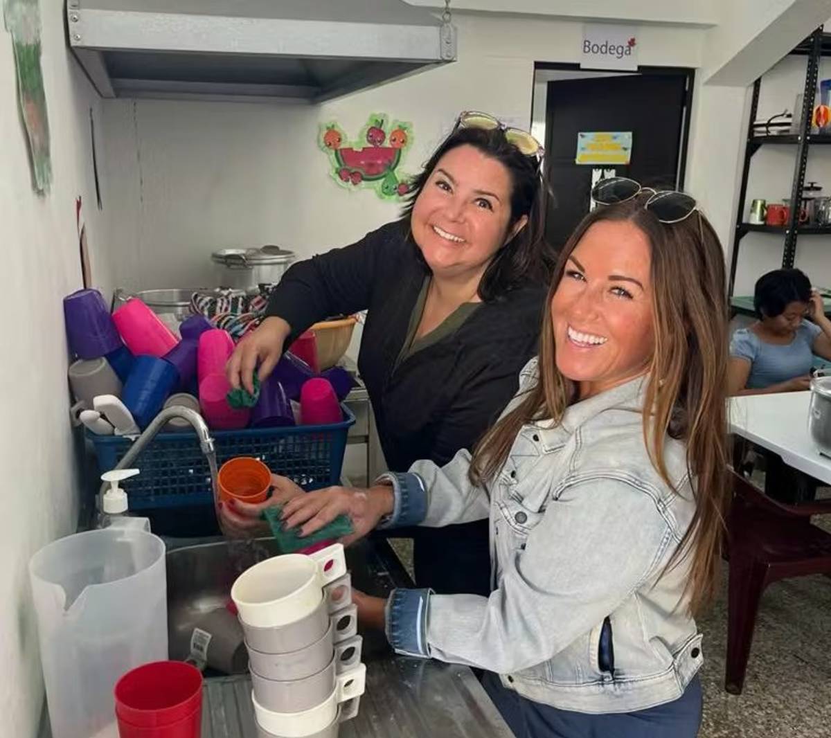 Two Female Volunteers Prepping Dishes to Distribute Food in Guatemala