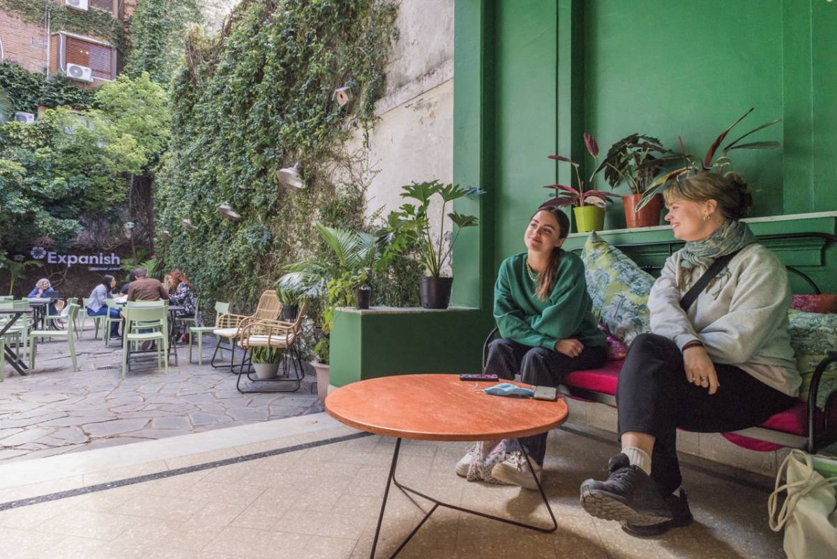 two people sitting in outdoor sofa