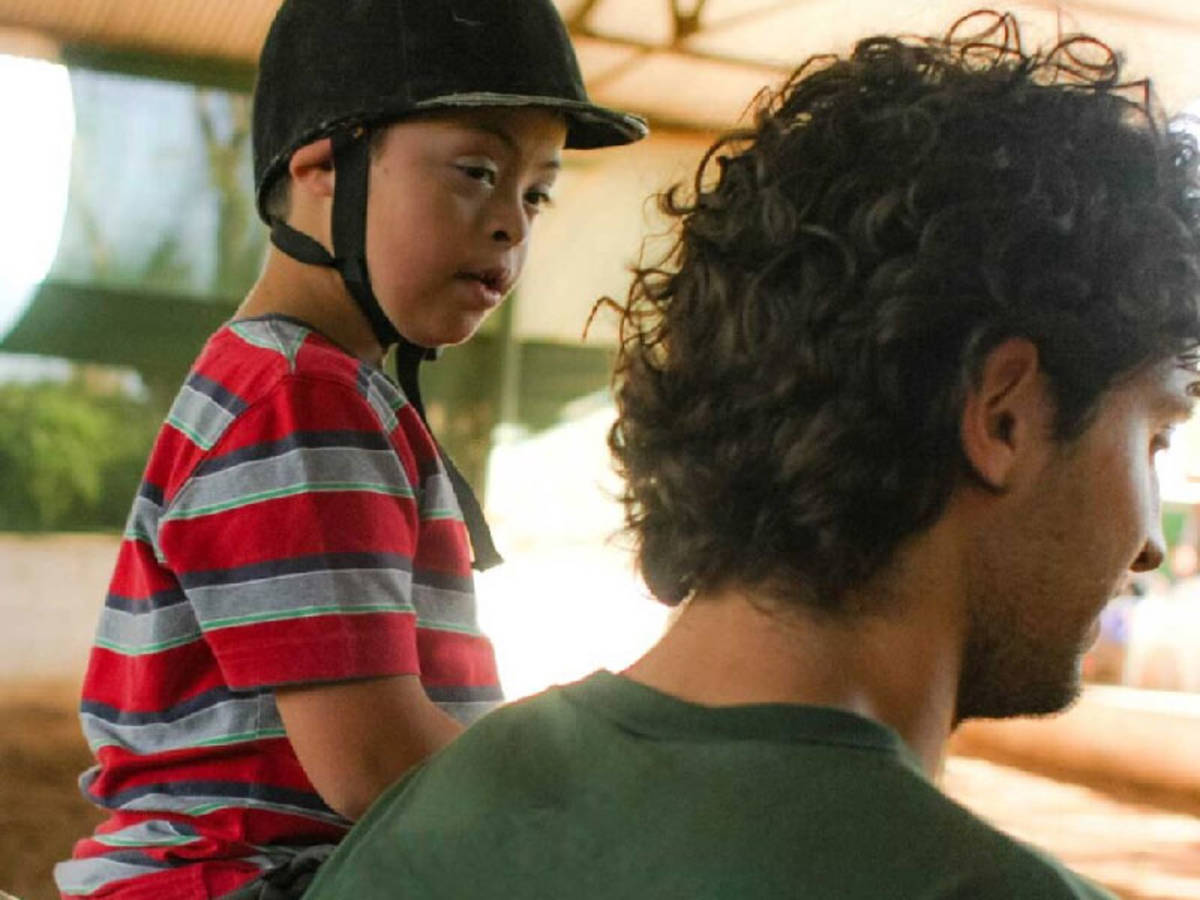 volunteer helping a child