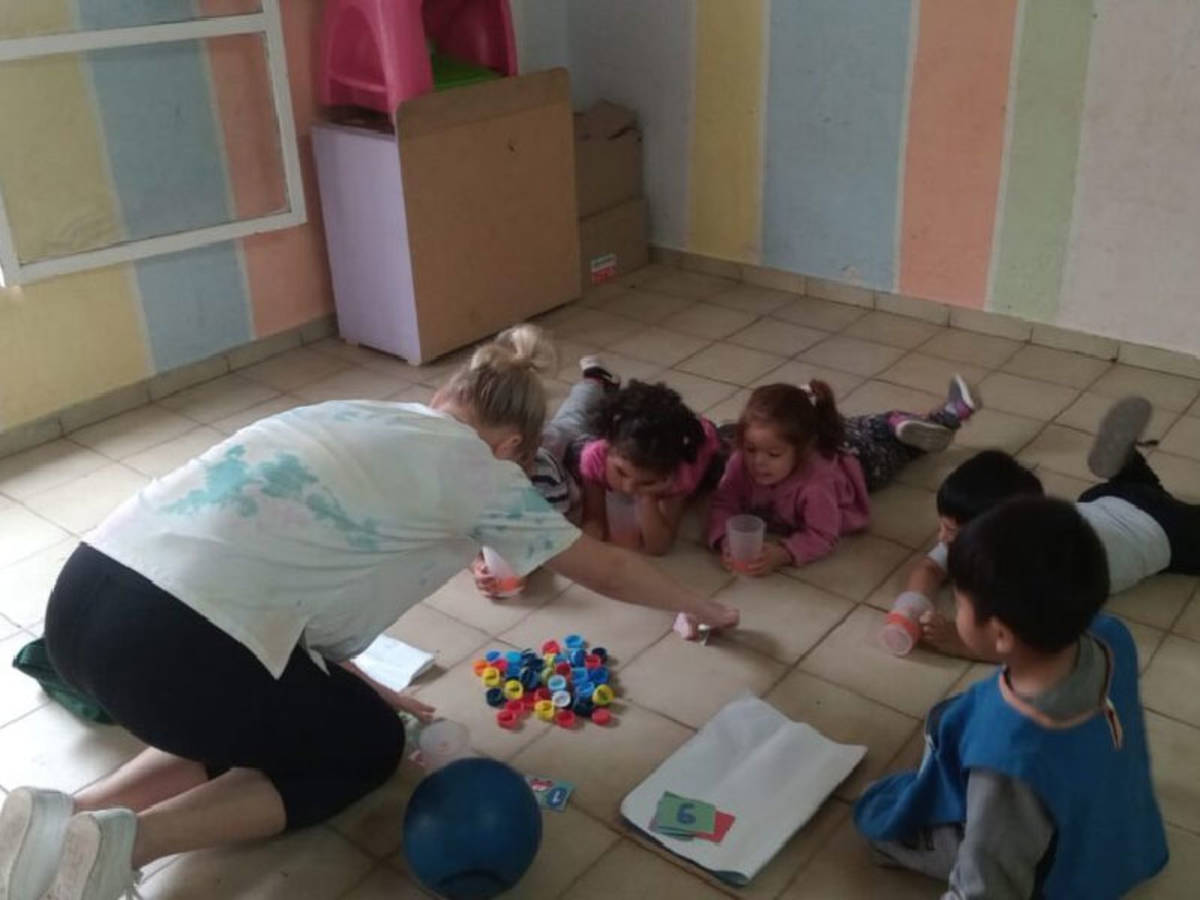 volunteer working with children in the program